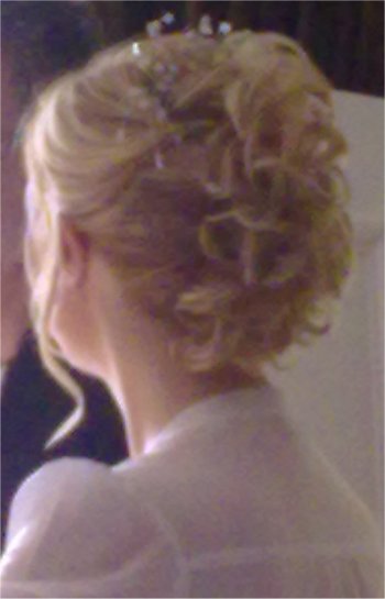 Wedding hair style using a curly clip in hair piece