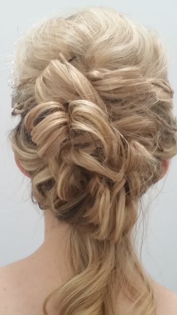 Soft vintage wedding hairstyle with rolls feminine and elegant