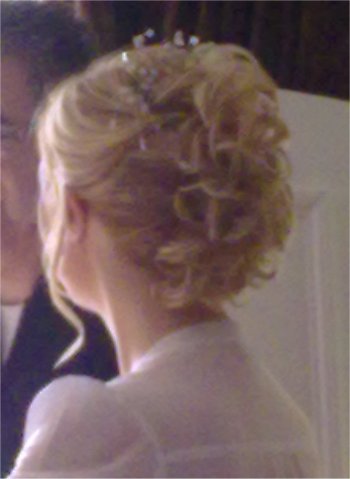 Bridal hair up curly with a hair piece