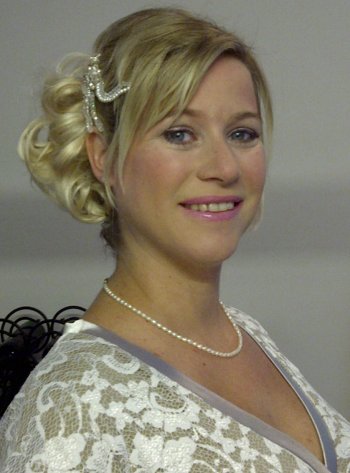 Wedding hair and makeup for a bride with short hair using a hair piece and crystal and pearl hair pins