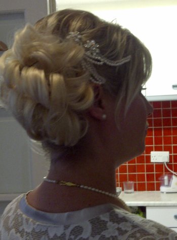 Bridal hair and makeup false hair piece and crystal and pearl hair pins