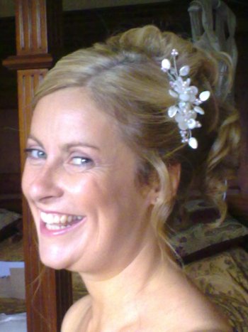 Bridal hair and makeup and wedding hair accessory on a comb