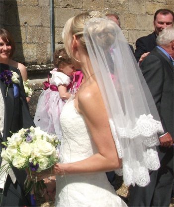 Large elegant chignon bridal hair style (vintage lace veil and stunning crystal hair accessory by www.irresistibleheaddresses.com 01403 871449)